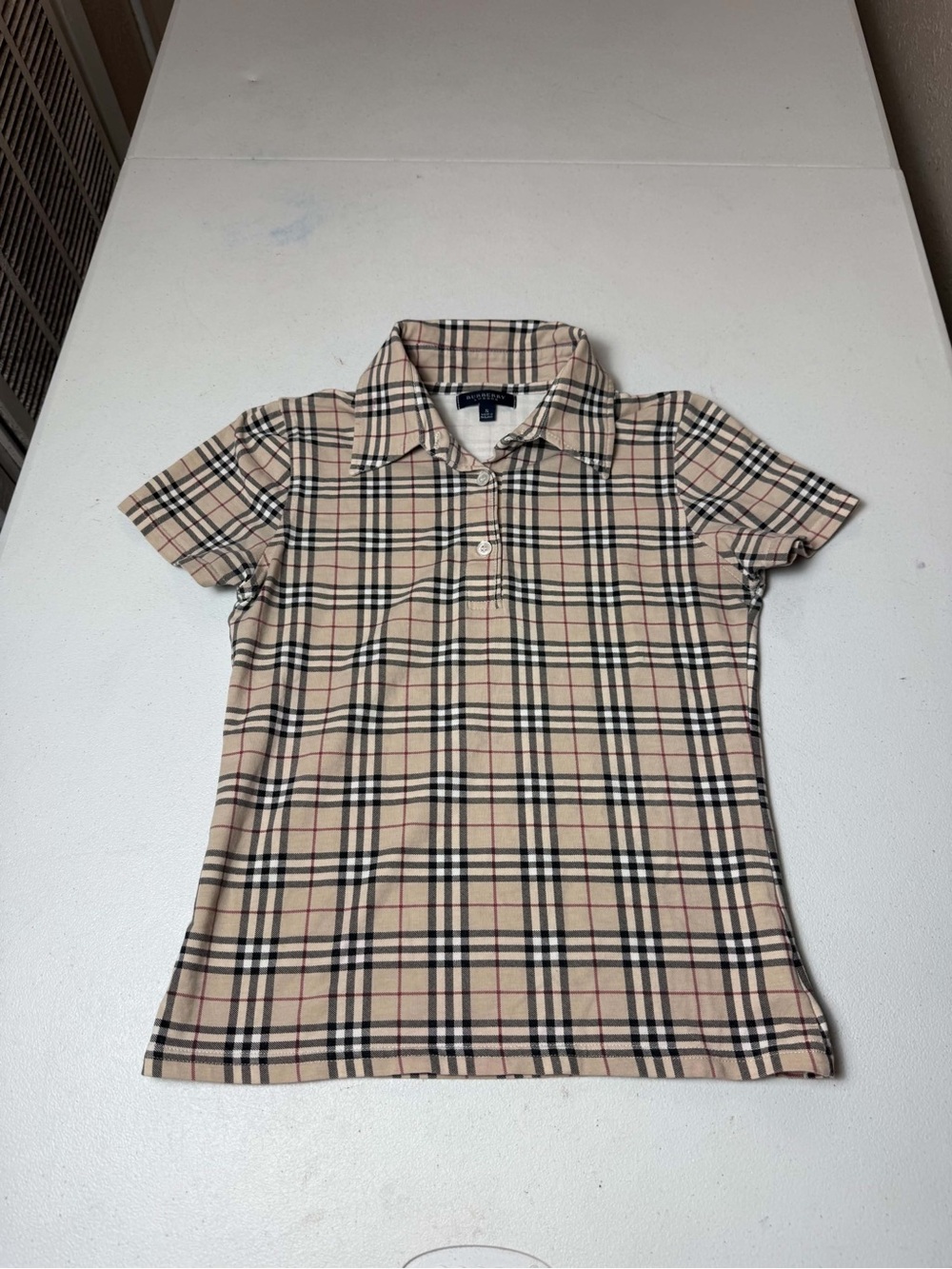 vintage Burberry short-sleeve polo shirt featuring the iconic beige Nova Check